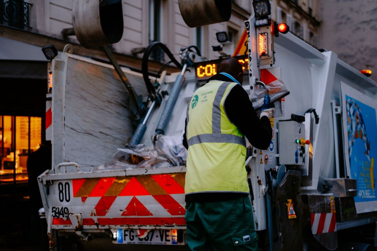 All Hands Junk Removal crew loading unwanted items into a clean truck